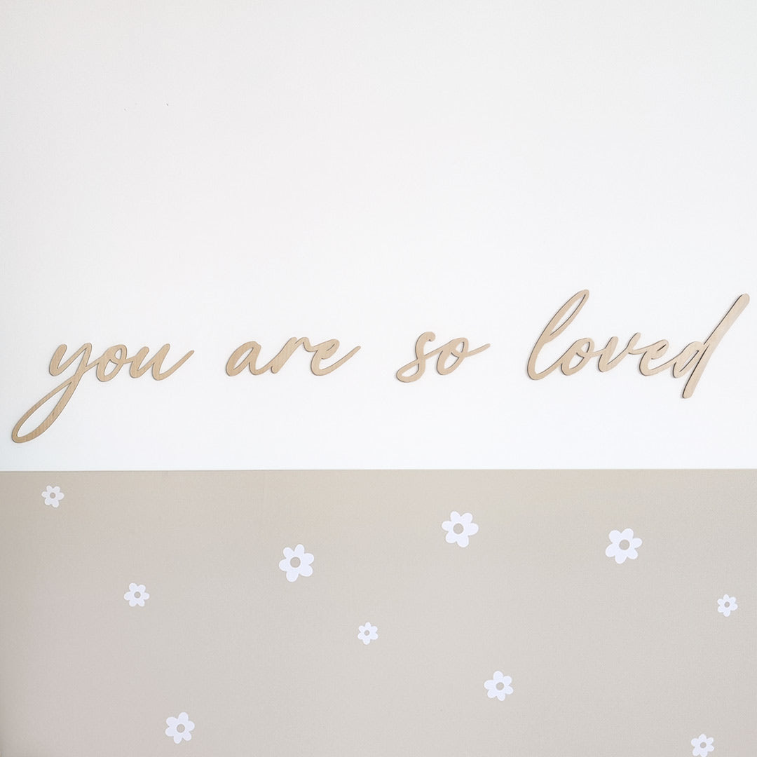 Wooden sign for children's room saying "you are so loved"
