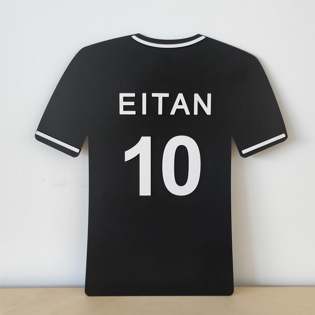 Soccer jersey with the child's name carved in wood for hanging