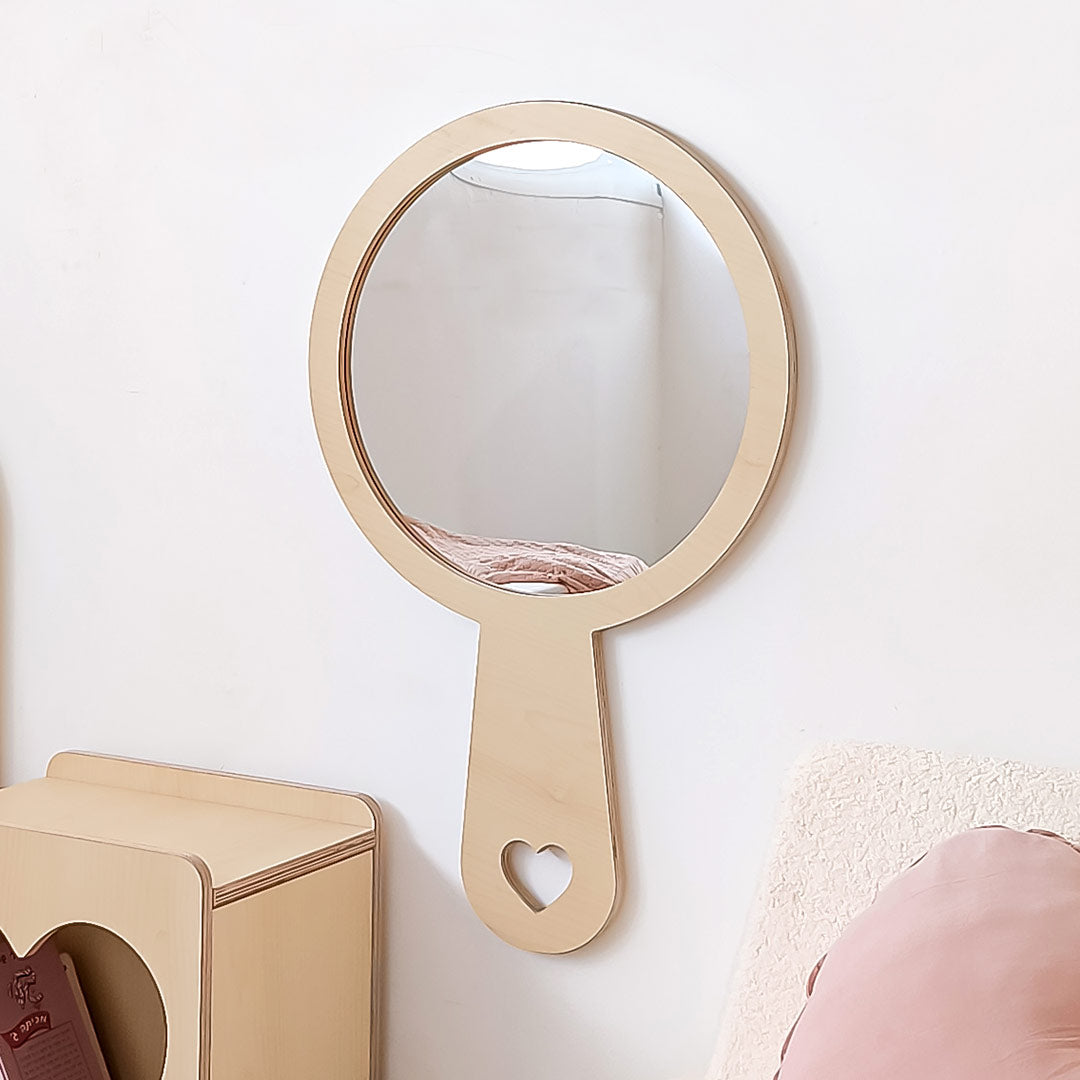 Wooden wall mirror for children in the shape of a hand mirror