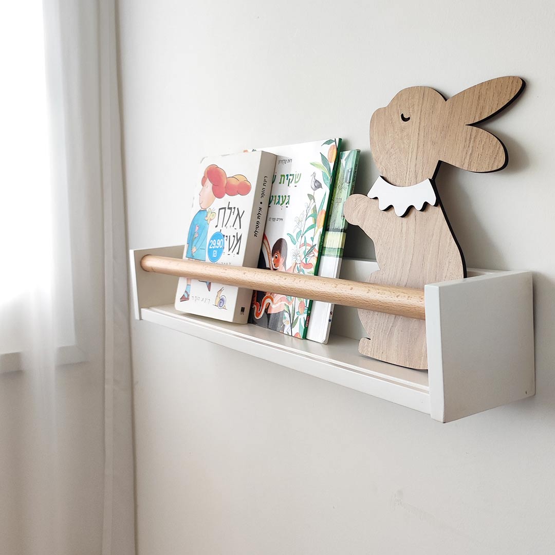 White bookshelf with wooden rod