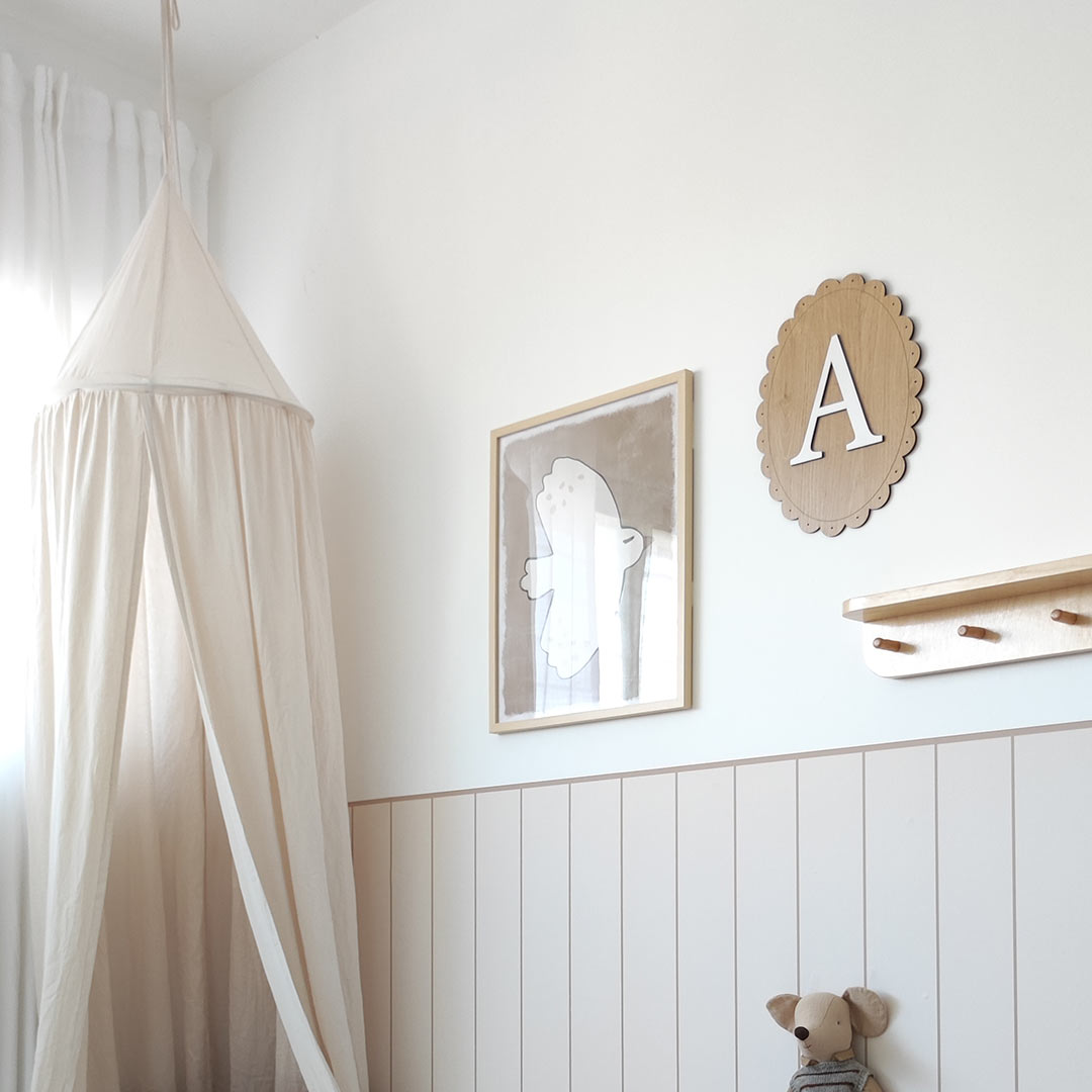 Name sign for a child's room – oval wooden sign with letter